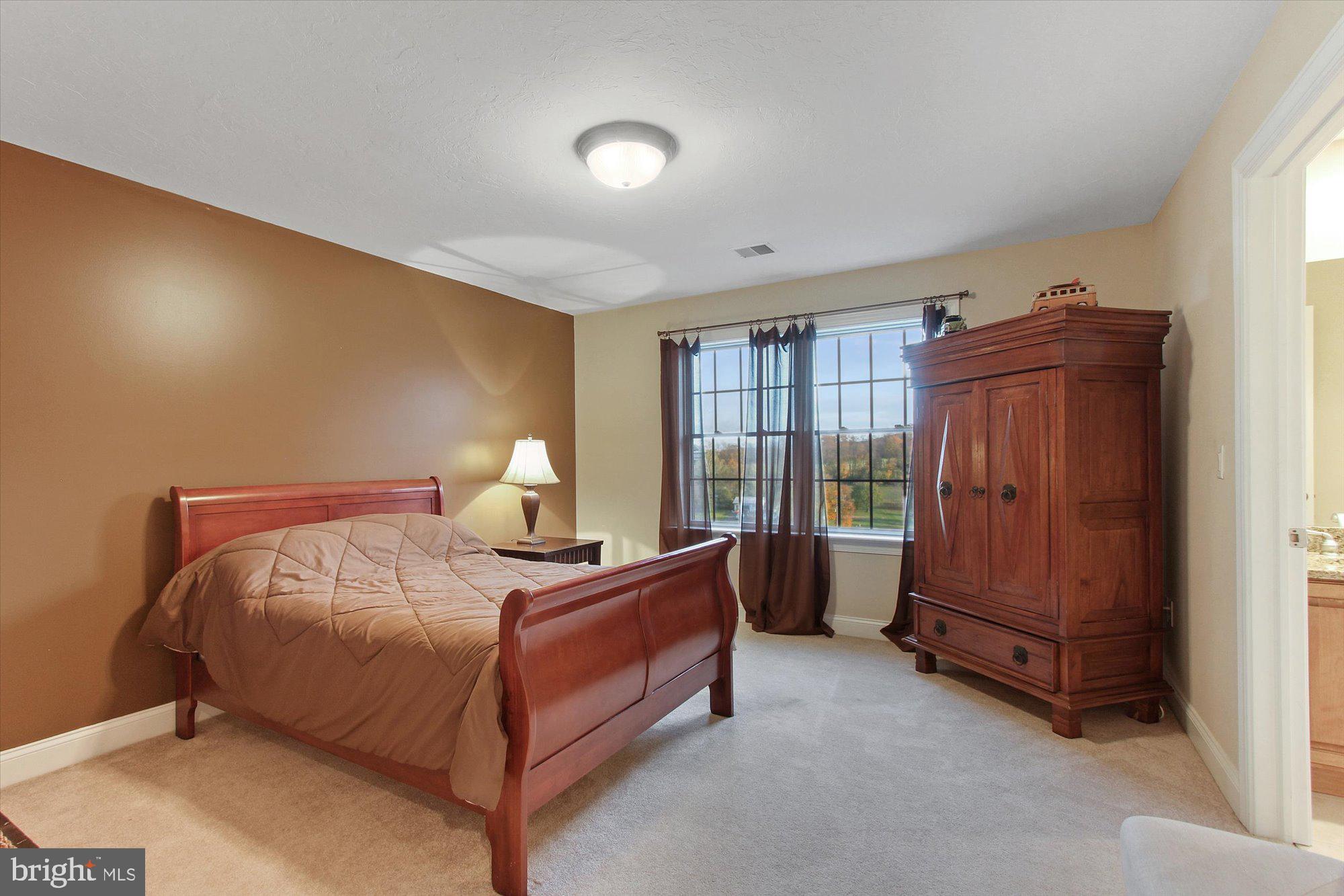 4549 Walters Hatchery Road Spring Grove, PA 17362 - Photo 30 of 64 a bedroom with a bed and window