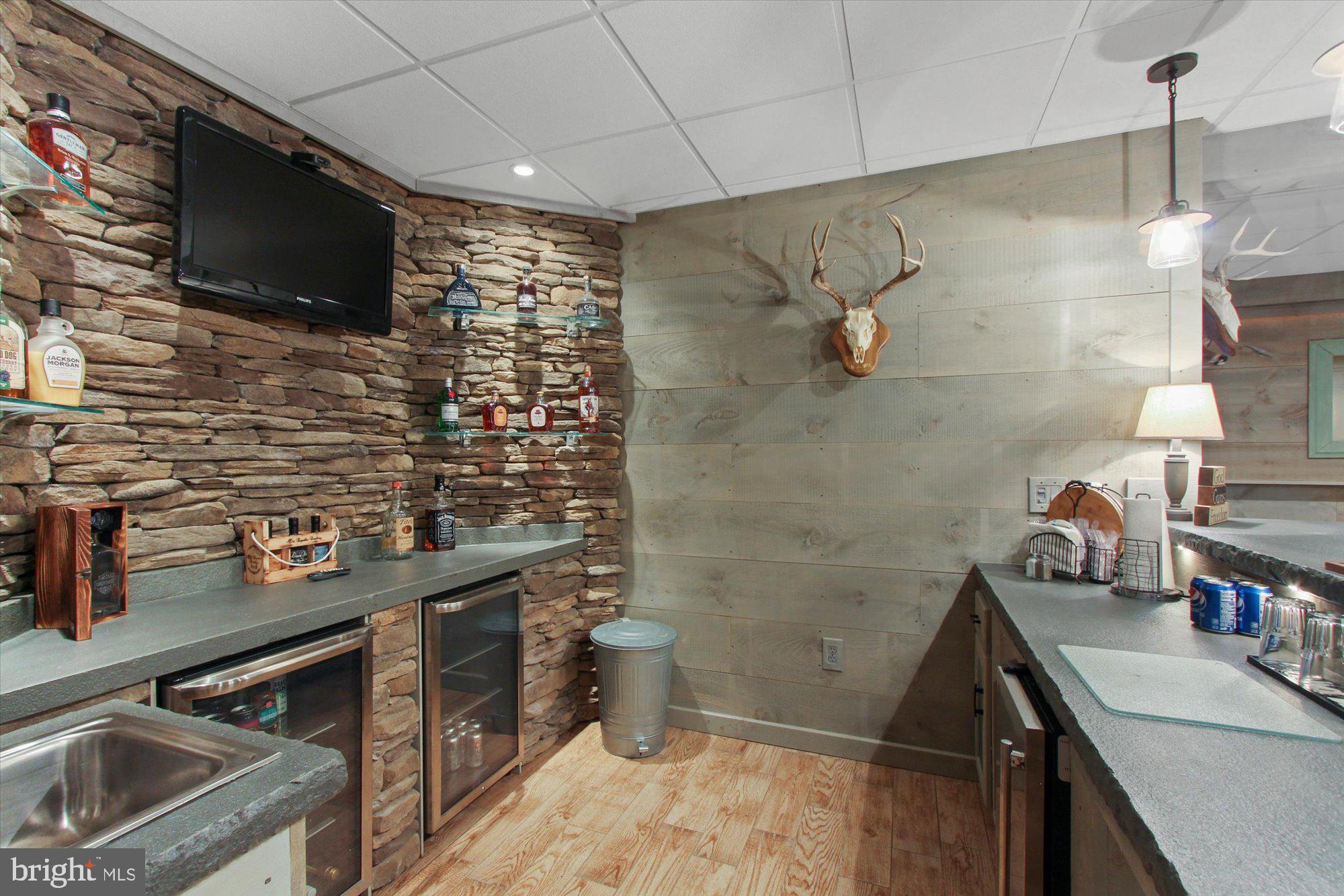 4549 Walters Hatchery Road Spring Grove, PA 17362 - Photo 35 of 64 a bathroom with a sink a toilet a mirror and shower