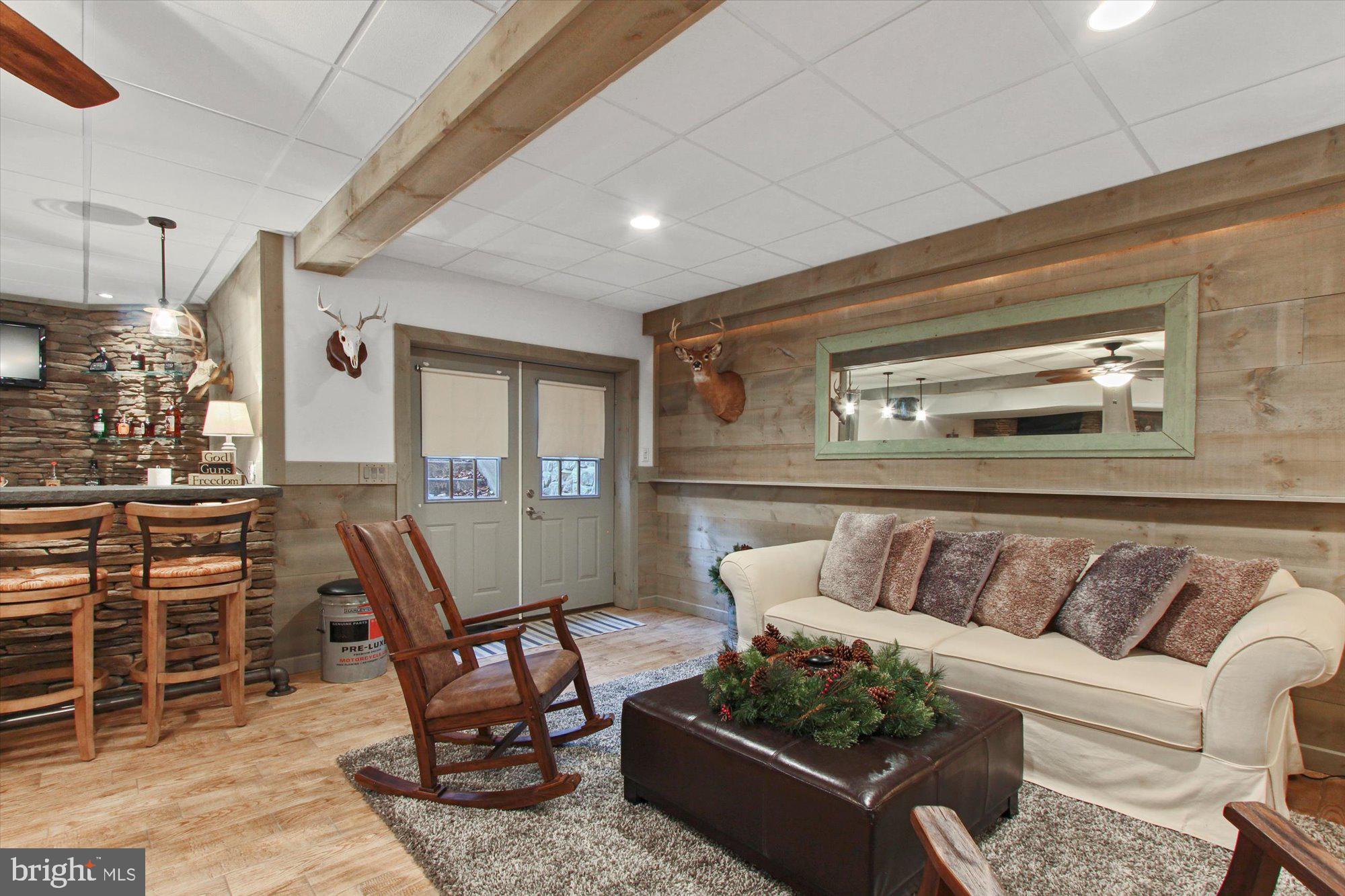 4549 Walters Hatchery Road Spring Grove, PA 17362 - Photo 38 of 64 a living room with furniture and wooden floor