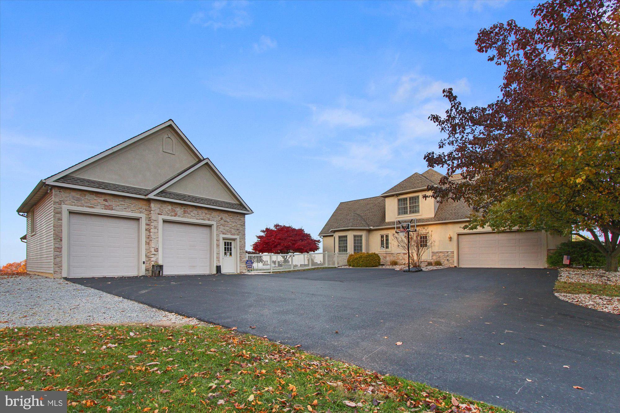 4549 Walters Hatchery Road Spring Grove, PA 17362 - Photo 5 of 64 a front view of a house with a yard and garage