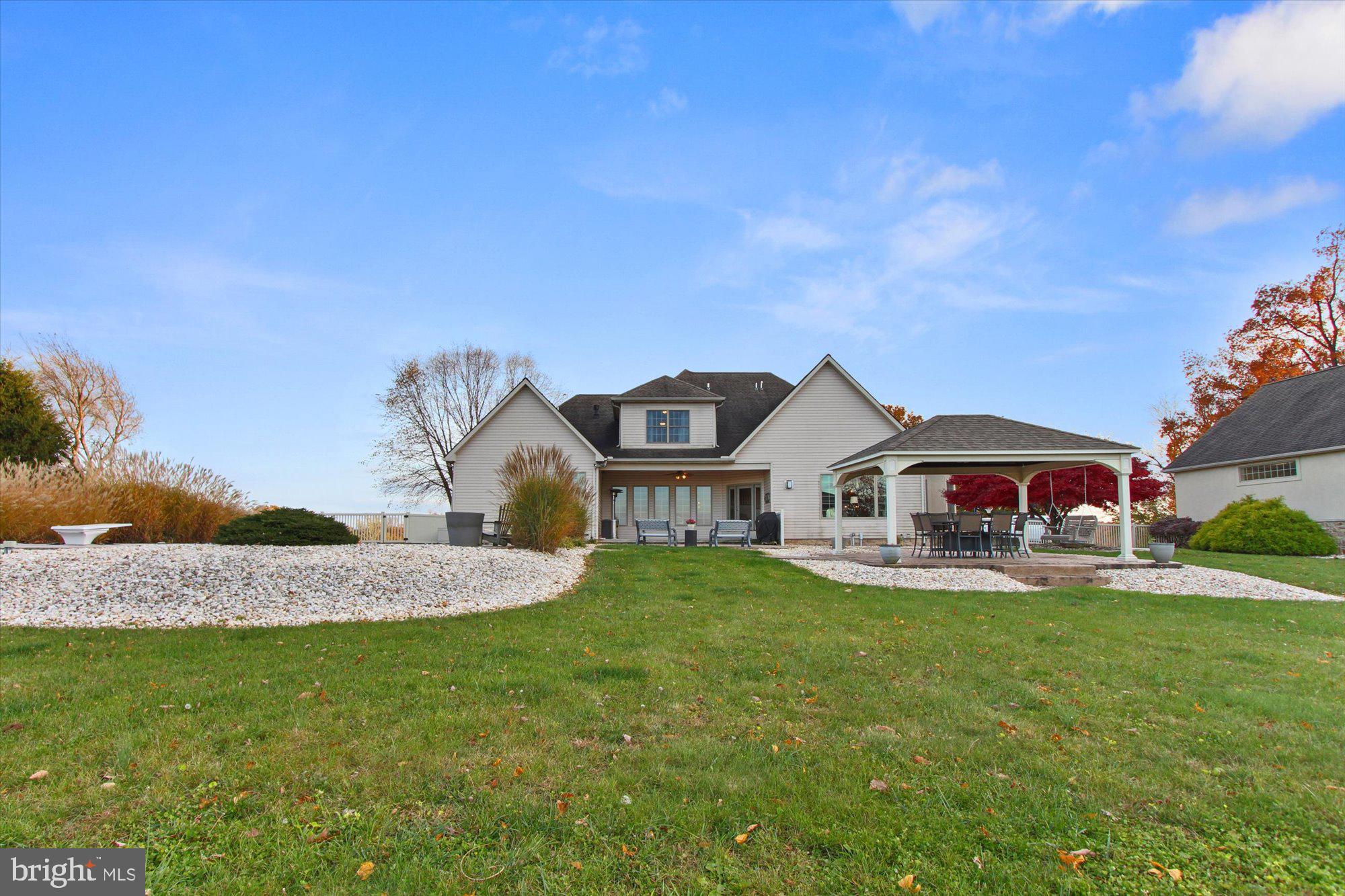 4549 Walters Hatchery Road Spring Grove, PA 17362 - Photo 50 of 64 a front view of a house with a yard and trees