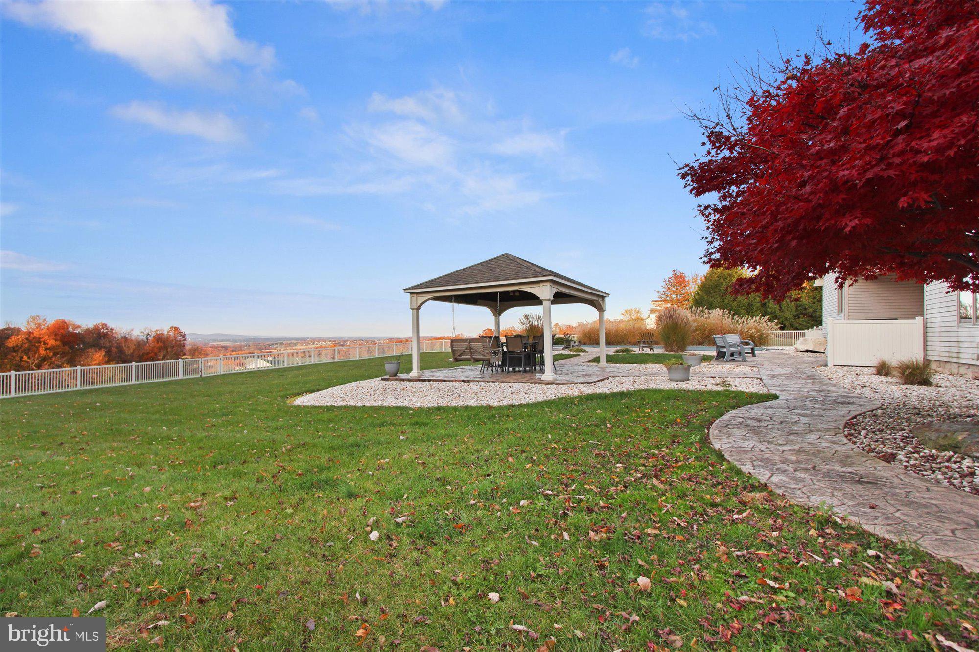 4549 Walters Hatchery Road Spring Grove, PA 17362 - Photo 51 of 64 a backyard of a house with table and chairs
