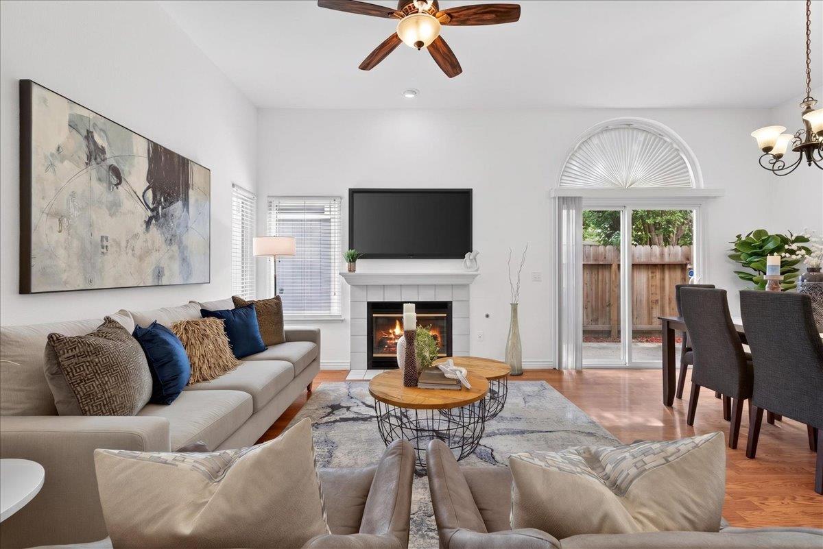 4353 Country Run Way Antelope, CA 95843 - Photo 11 of 28 a living room with furniture a fireplace and a flat screen tv