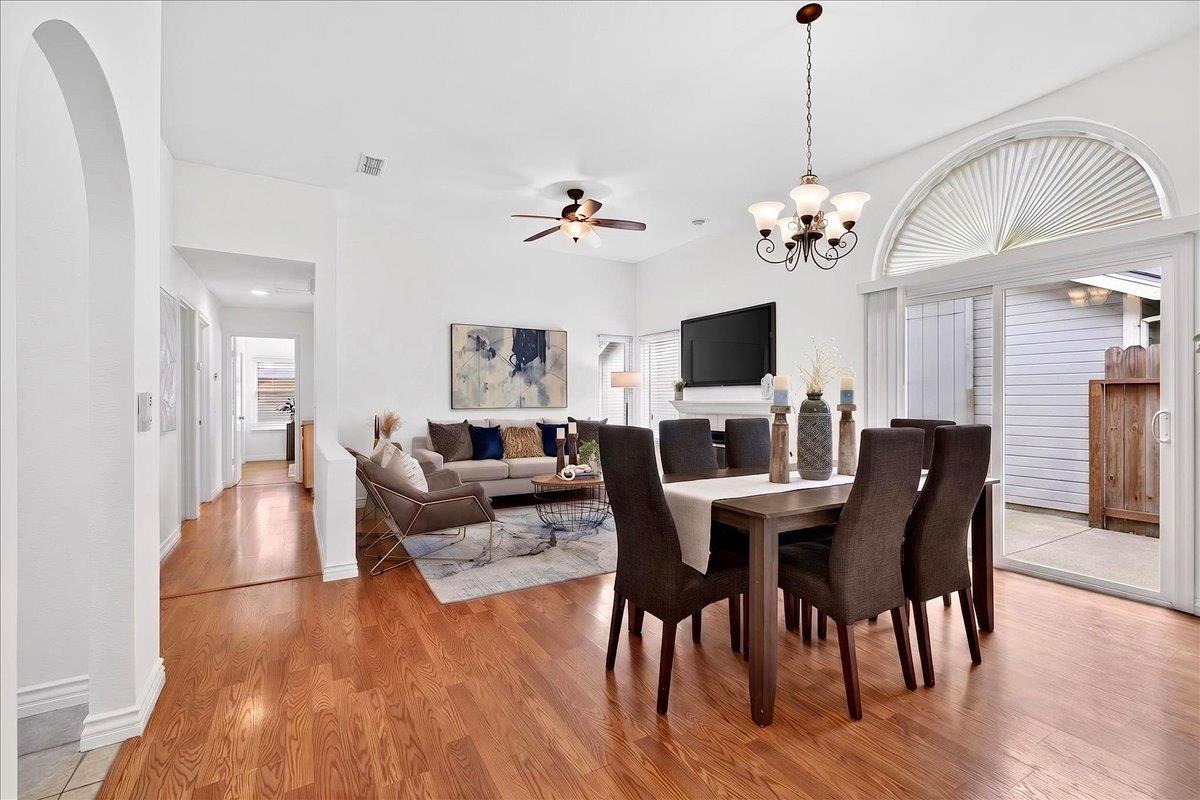 4353 Country Run Way Antelope, CA 95843 - Photo 4 of 28 a view of a dining room with furniture wooden floor and chandelier