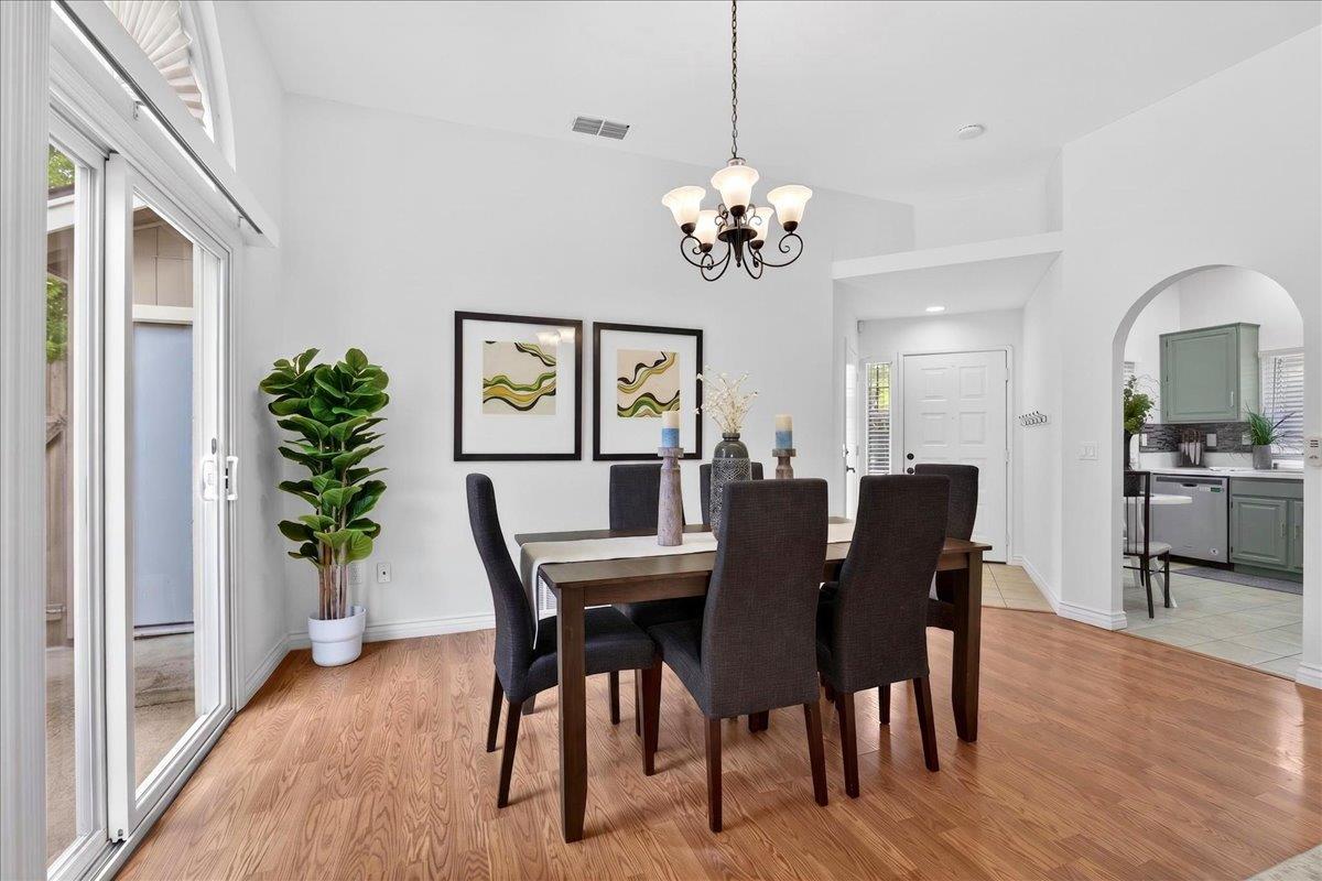 4353 Country Run Way Antelope, CA 95843 - Photo 5 of 28 a view of a dining room with furniture wooden floor and chandelier