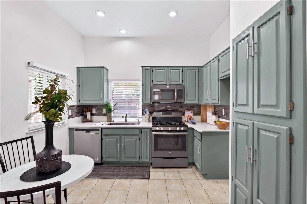 4353 Country Run Way Antelope, CA 95843 - Photo 6 of 28 a kitchen with stainless steel appliances a sink and a refrigerator