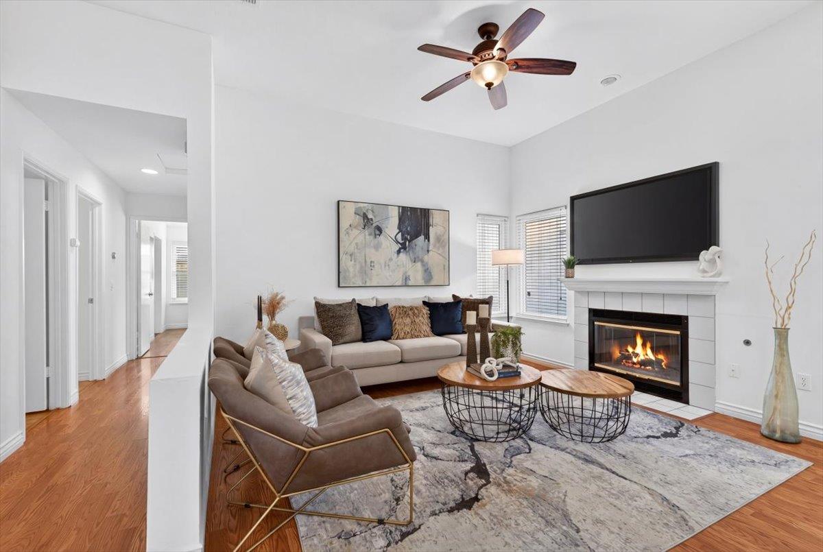4353 Country Run Way Antelope, CA 95843 - Photo 10 of 28 a living room with furniture a fireplace and a flat screen tv