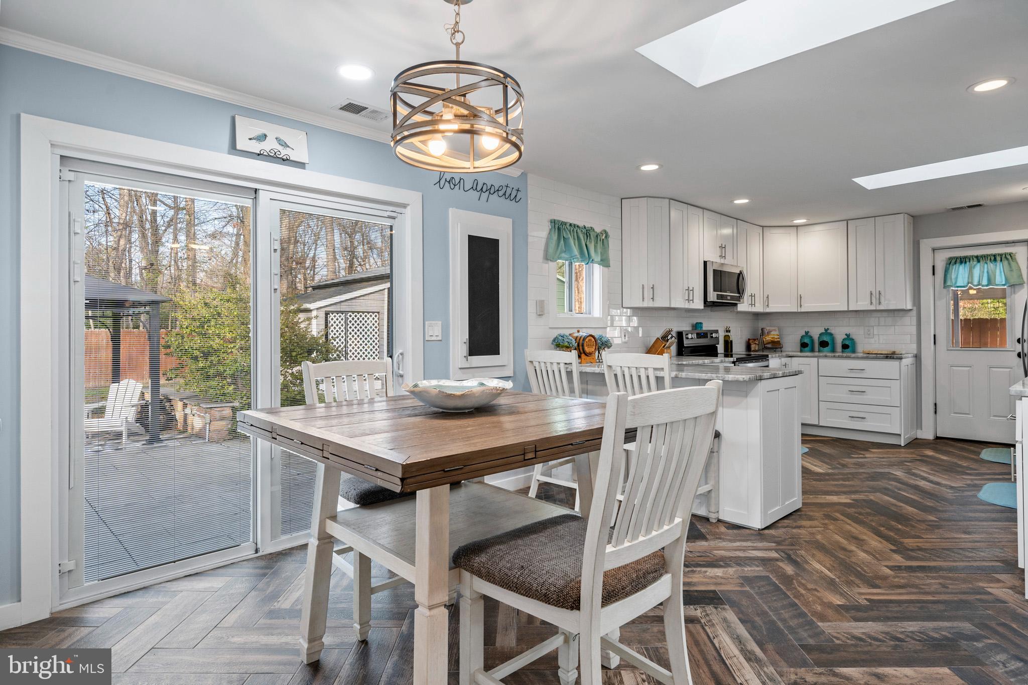 317 Biddle Road Accokeek, MD 20607 - Photo 16 of 44 a kitchen with a table chairs and microwave
