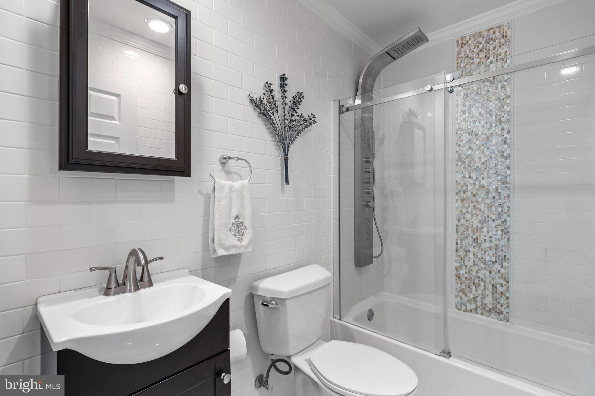 317 Biddle Road Accokeek, MD 20607 - Photo 20 of 44 a bathroom with a sink toilet and shower