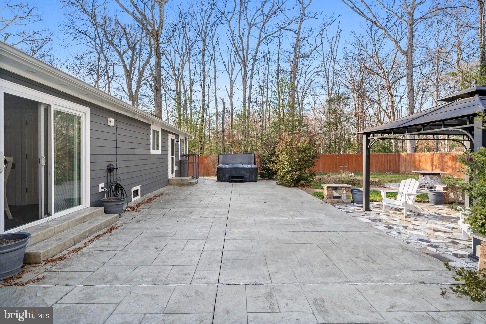 317 Biddle Road Accokeek, MD 20607 - Photo 33 of 44 a view of a chairs and tables in the back yard of the house