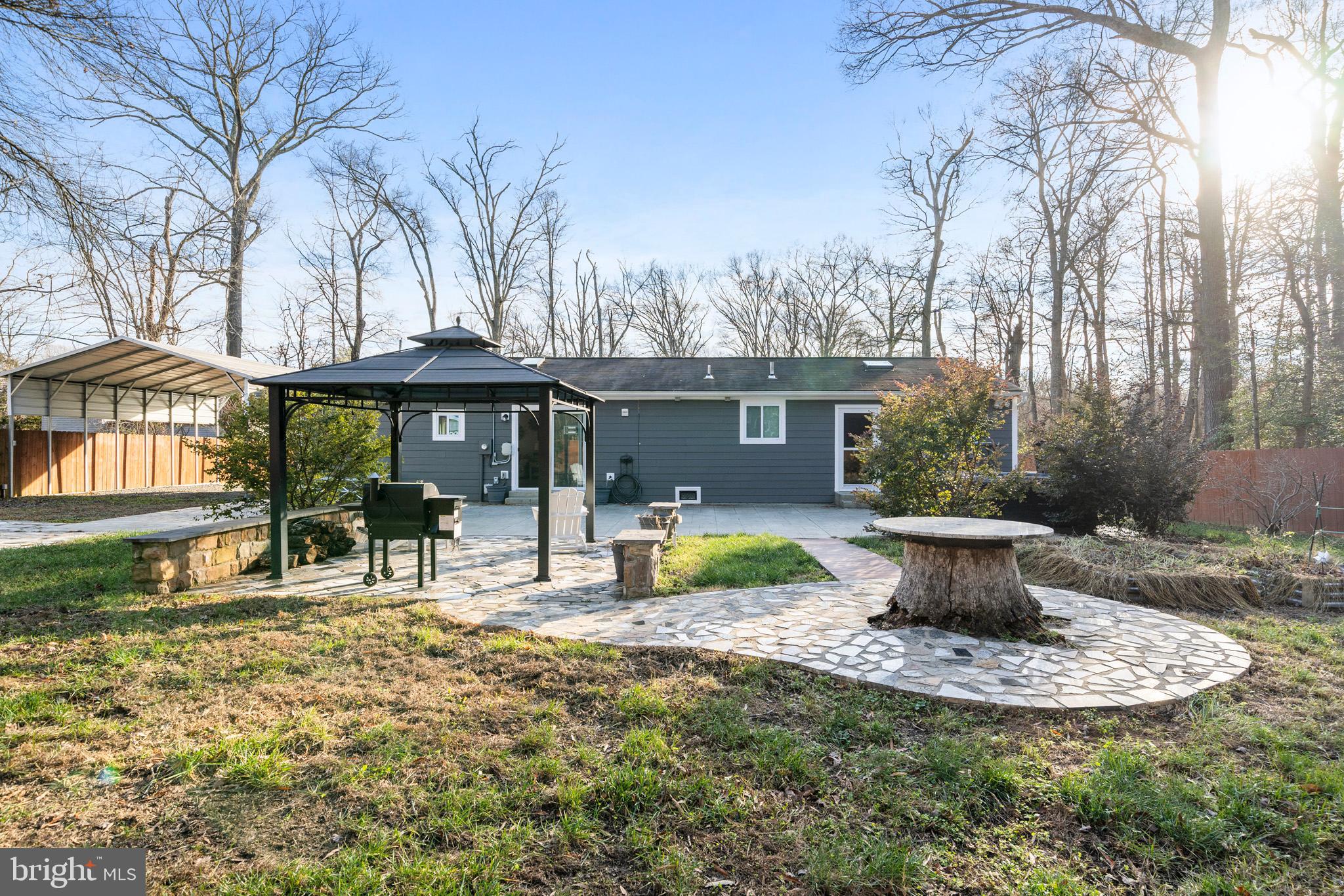 317 Biddle Road Accokeek, MD 20607 - Photo 35 of 44 a view of a house with backyard sitting area and garden