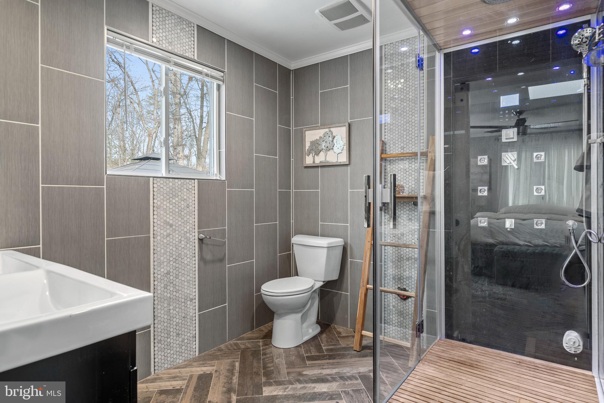 317 Biddle Road Accokeek, MD 20607 - Photo 6 of 44 a bathroom with a toilet and a shower