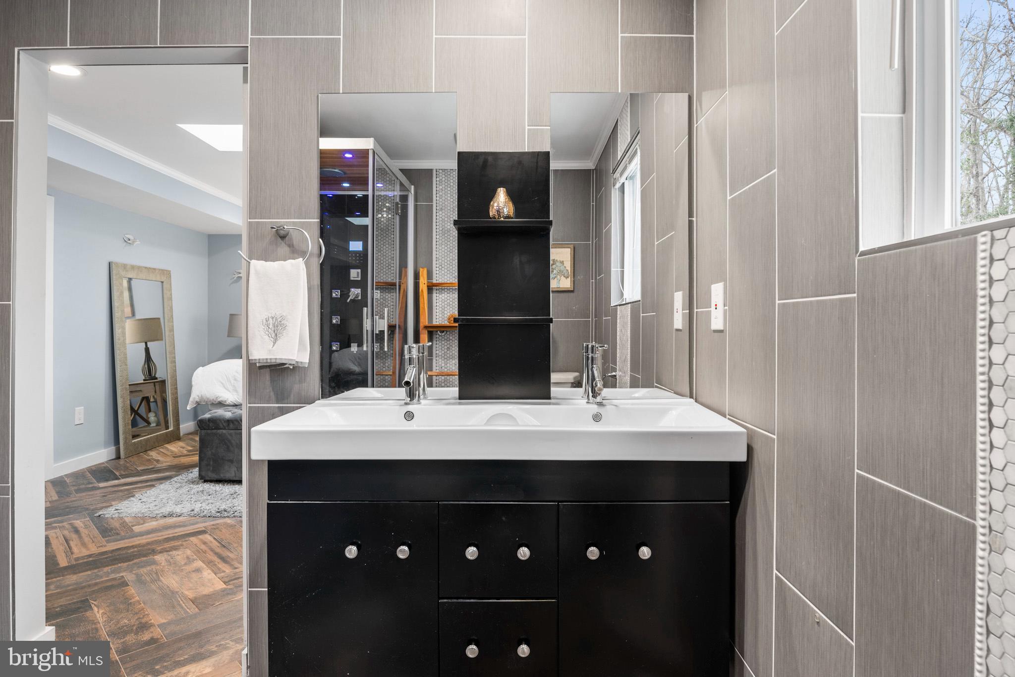 317 Biddle Road Accokeek, MD 20607 - Photo 7 of 44 a bathroom with a sink vanity and a mirror