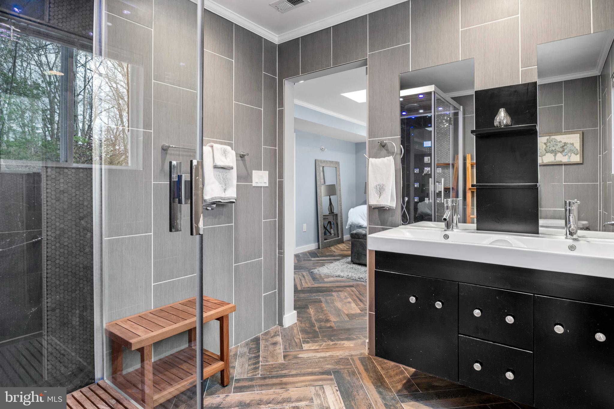 317 Biddle Road Accokeek, MD 20607 - Photo 8 of 44 a spacious bathroom with a granite countertop sink mirror and shower