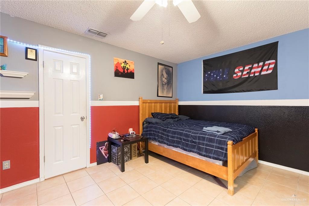 2801 Hawk Avenue McAllen, TX 78504 - Photo 11 of 19 a living room with furniture and a flat screen tv