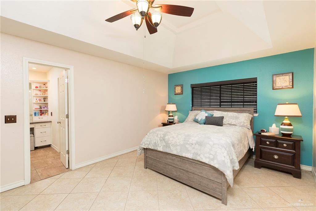 2801 Hawk Avenue McAllen, TX 78504 - Photo 9 of 19 a bedroom with a bed and a walk in closet