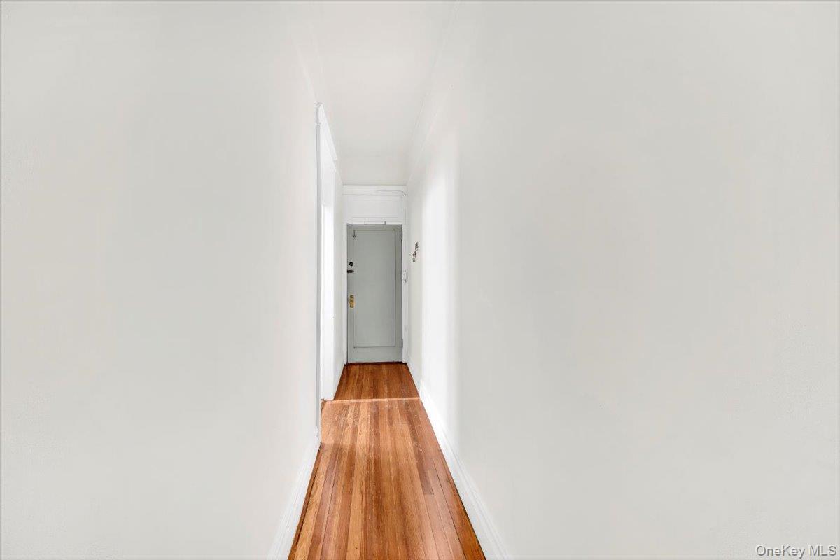 2312 Morgan Avenue Bronx, NY 10469 - Photo 13 of 36 Hallway with baseboards and wood-type flooring