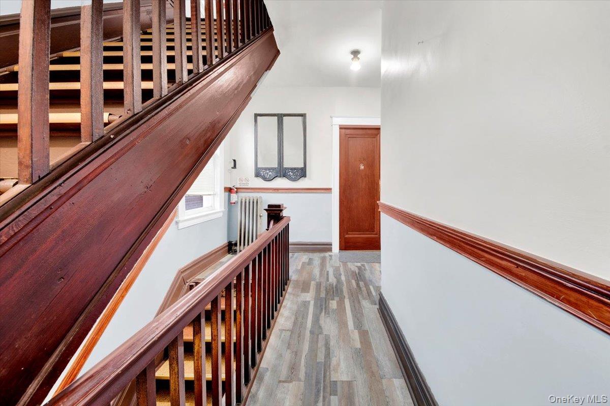 2312 Morgan Avenue Bronx, NY 10469 - Photo 17 of 36 Staircase featuring wood finished floors