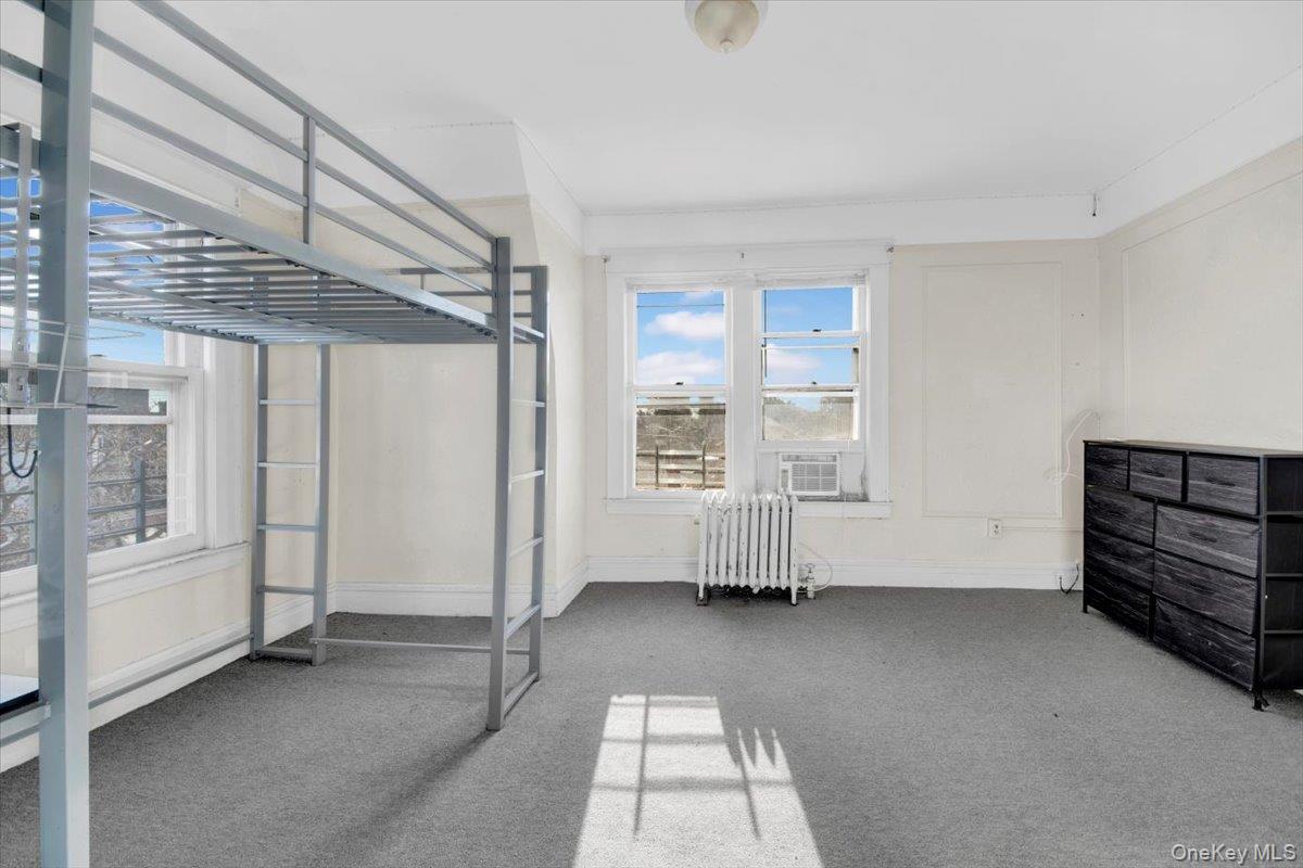 2312 Morgan Avenue Bronx, NY 10469 - Photo 20 of 36 Unfurnished bedroom with carpet and radiator
