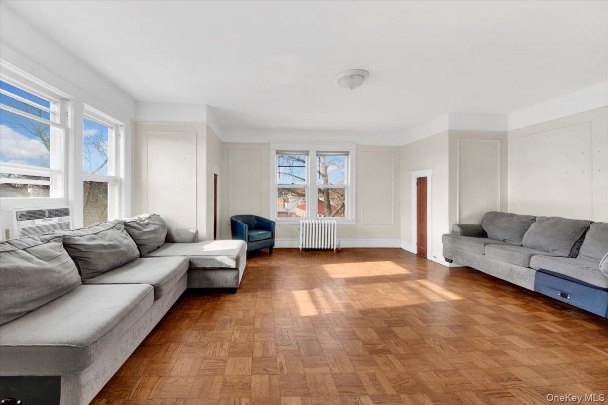 2312 Morgan Avenue Bronx, NY 10469 - Photo 26 of 36 Living area with radiator heating unit and healthy amount of natural light