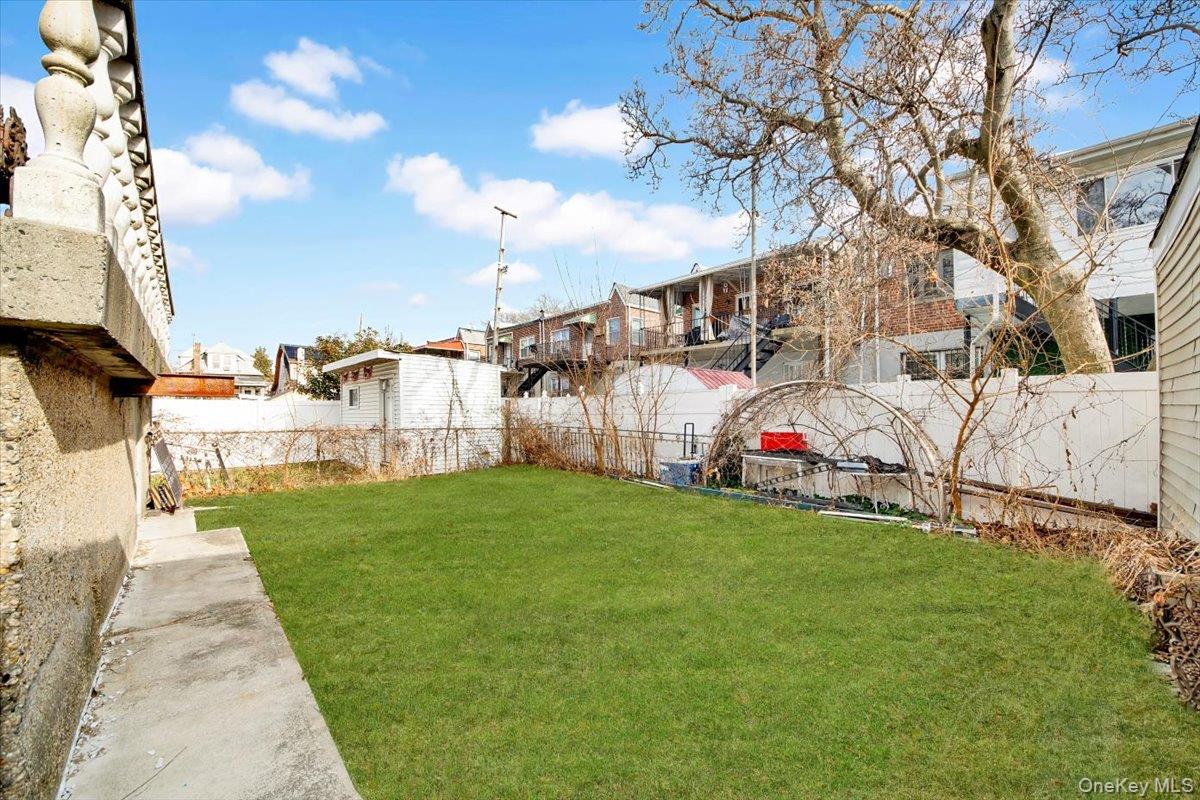 2312 Morgan Avenue Bronx, NY 10469 - Photo 4 of 36 Fenced yard with a residential view