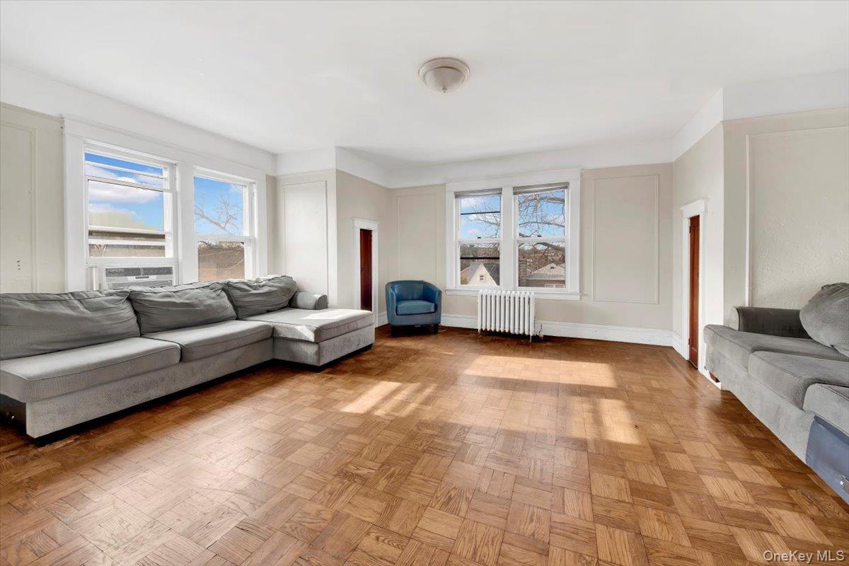 2312 Morgan Avenue Bronx, NY 10469 - Photo 10 of 36 Living room with radiator heating unit and baseboards