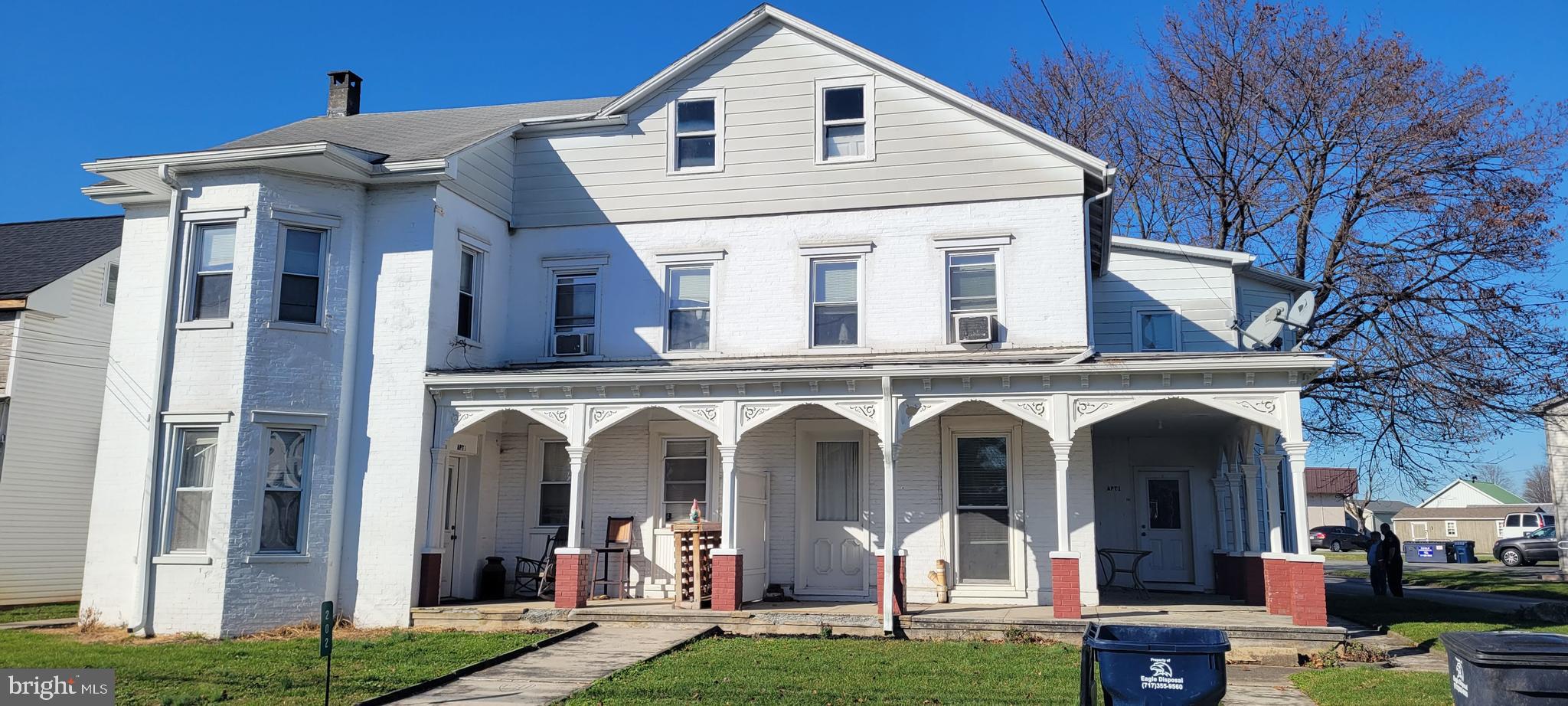 202 Maple Street, Unit 3 Gordonville, PA 17529 - Photo 1 of 9 a view of a white house with large windows