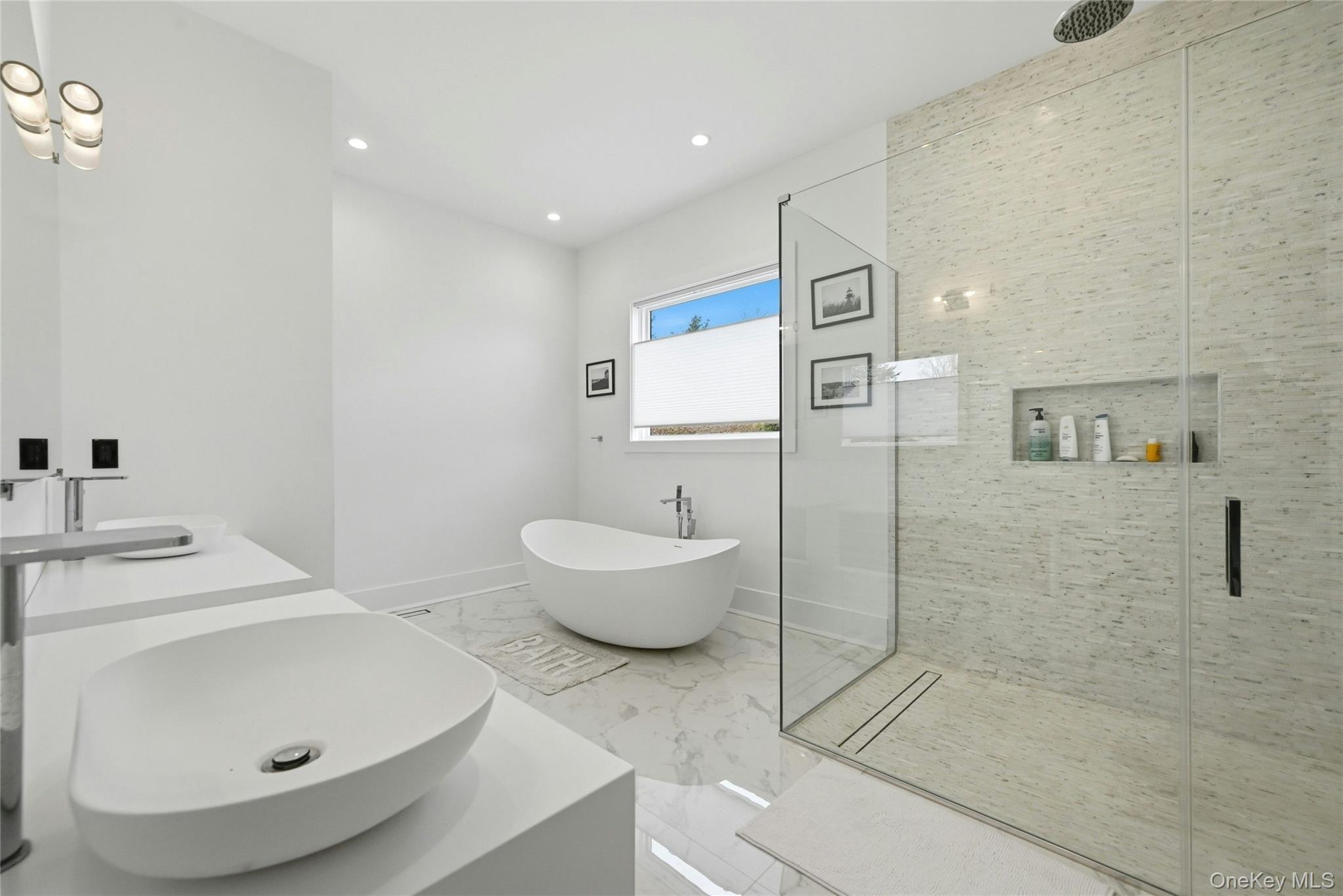 43 Smugglers Path Riverhead, NY 11901 - Photo 13 of 37 a bathroom with a sink and mirror