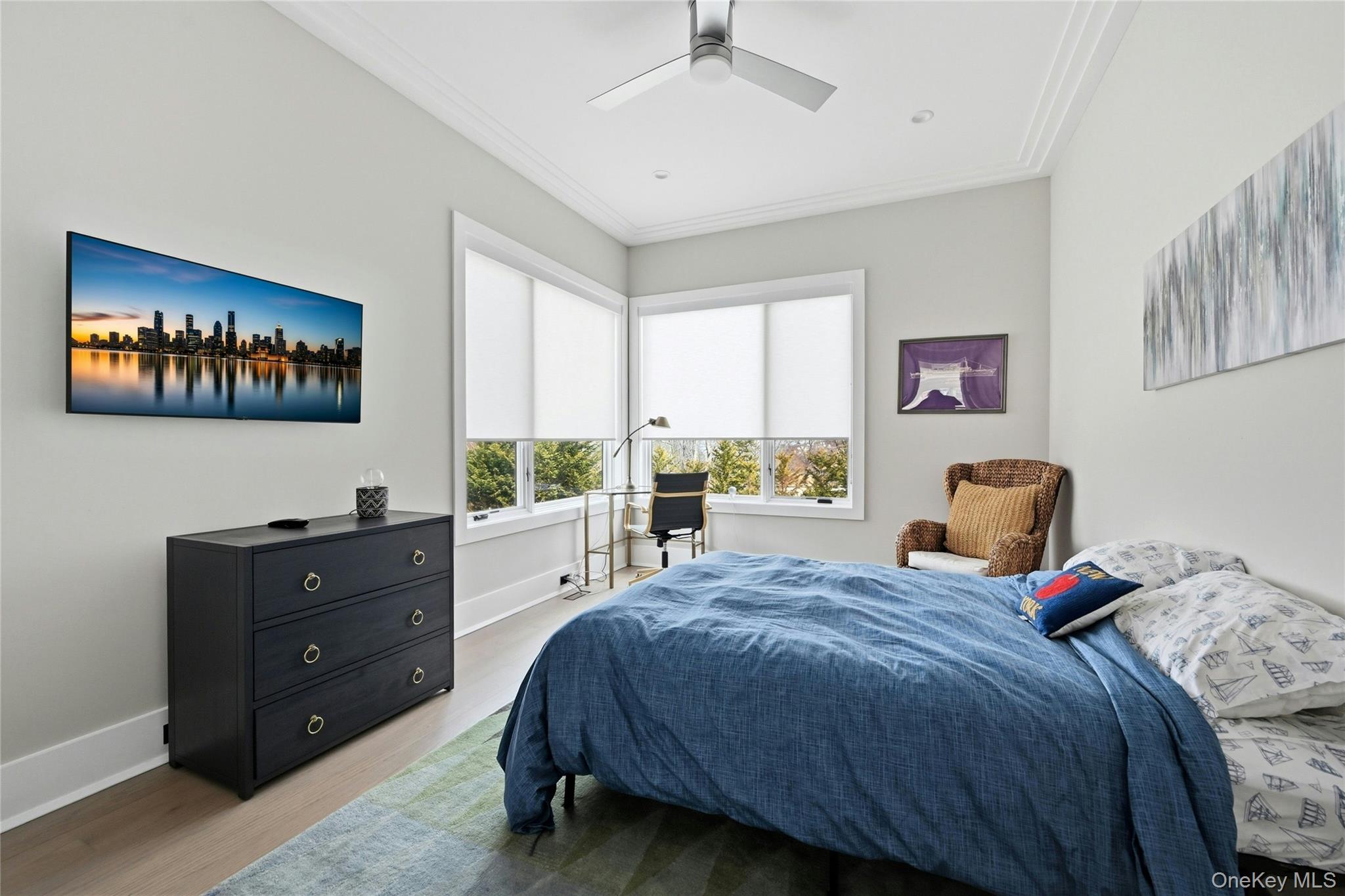 43 Smugglers Path Riverhead, NY 11901 - Photo 14 of 37 a bedroom with a bed and a painting on the wall