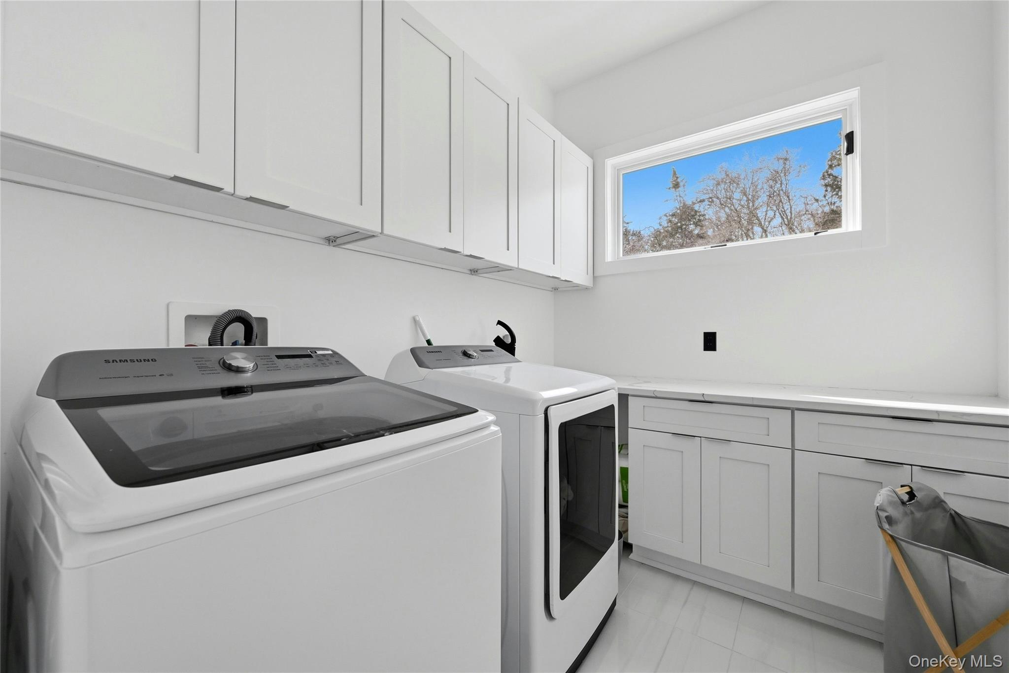 43 Smugglers Path Riverhead, NY 11901 - Photo 15 of 37 a utility room with sink dryer and washer