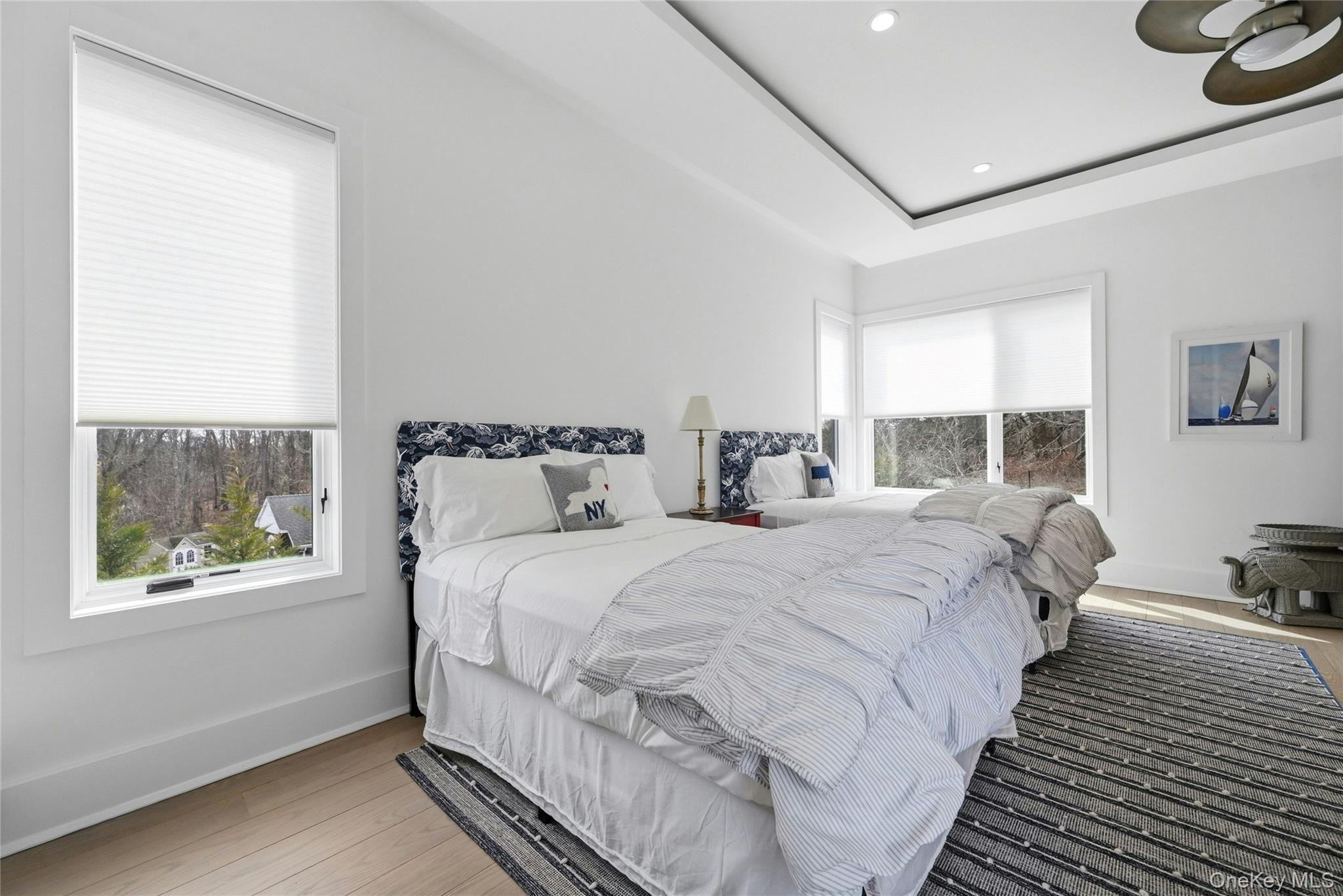 43 Smugglers Path Riverhead, NY 11901 - Photo 18 of 37 a bedroom with bed and window