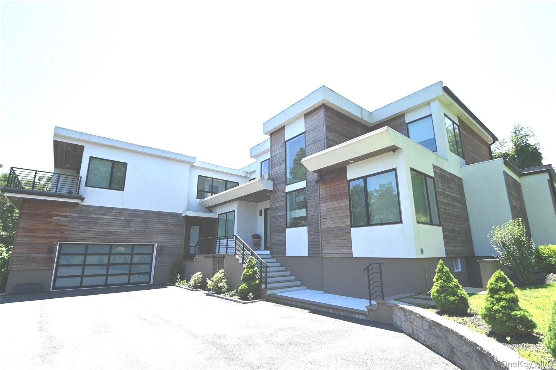 43 Smugglers Path Riverhead, NY 11901 - Photo 2 of 17 a front view of a house with a yard