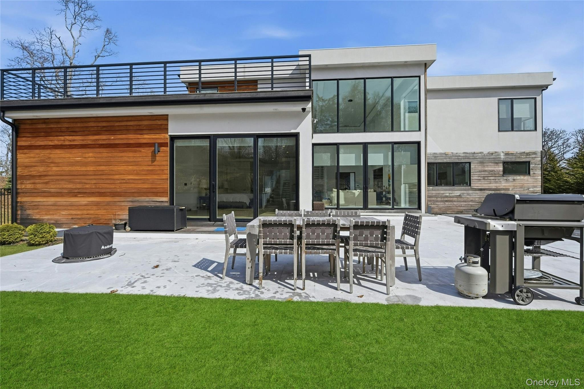 43 Smugglers Path Riverhead, NY 11901 - Photo 28 of 37 a house view with a sitting space and garden