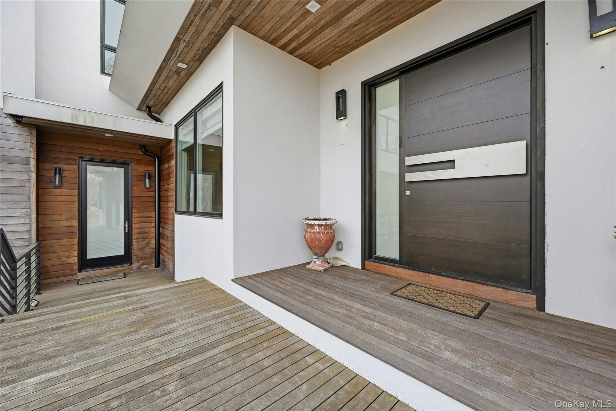 43 Smugglers Path Riverhead, NY 11901 - Photo 3 of 37 a view of an empty room with wooden floor and a window