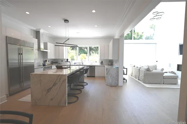 a kitchen with refrigerator and window