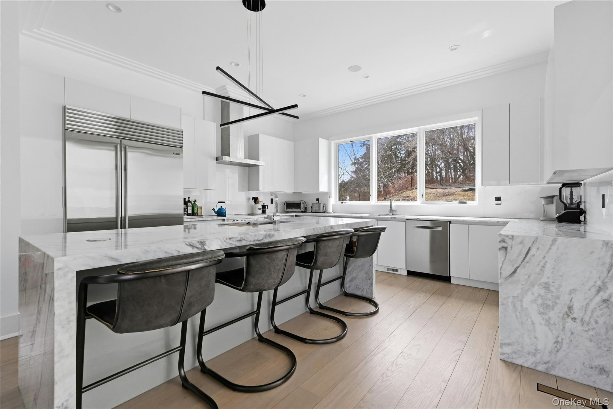 43 Smugglers Path Riverhead, NY 11901 - Photo 4 of 37 a kitchen with a sink cabinets and window