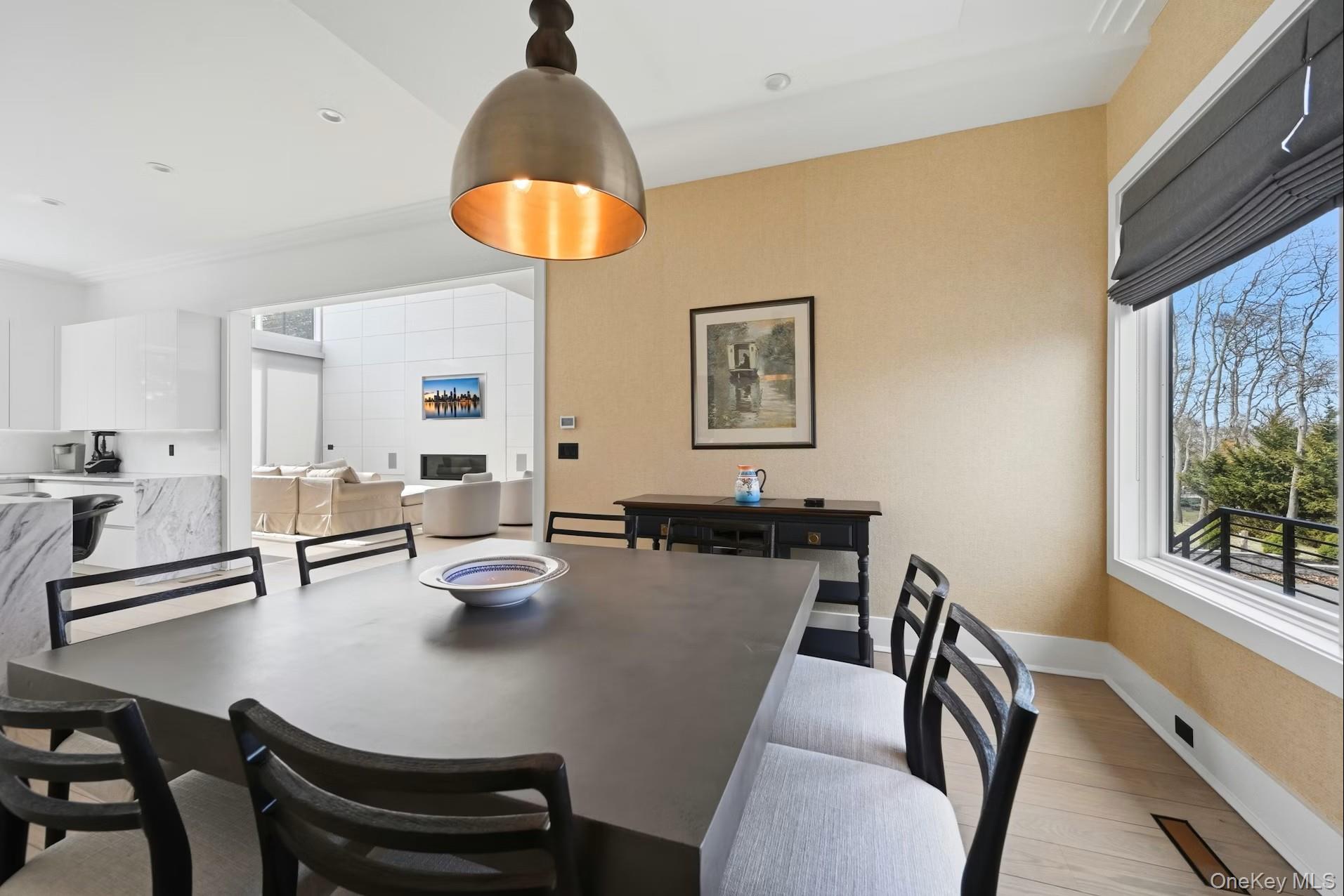 43 Smugglers Path Riverhead, NY 11901 - Photo 7 of 37 a view of a dining room with furniture and a chandelier