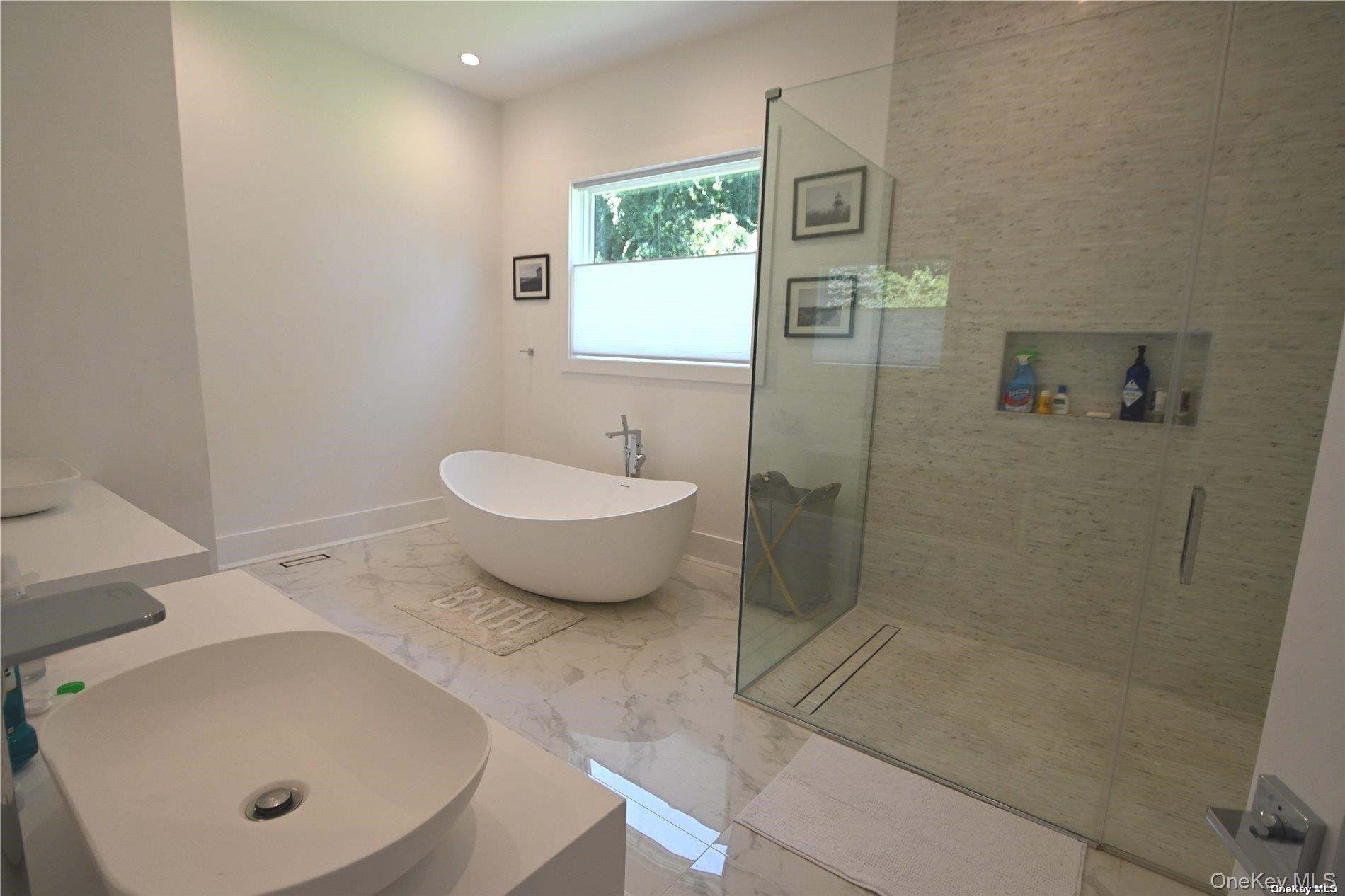 43 Smugglers Path Riverhead, NY 11901 - Photo 8 of 17 a bathroom with a sink and a mirror