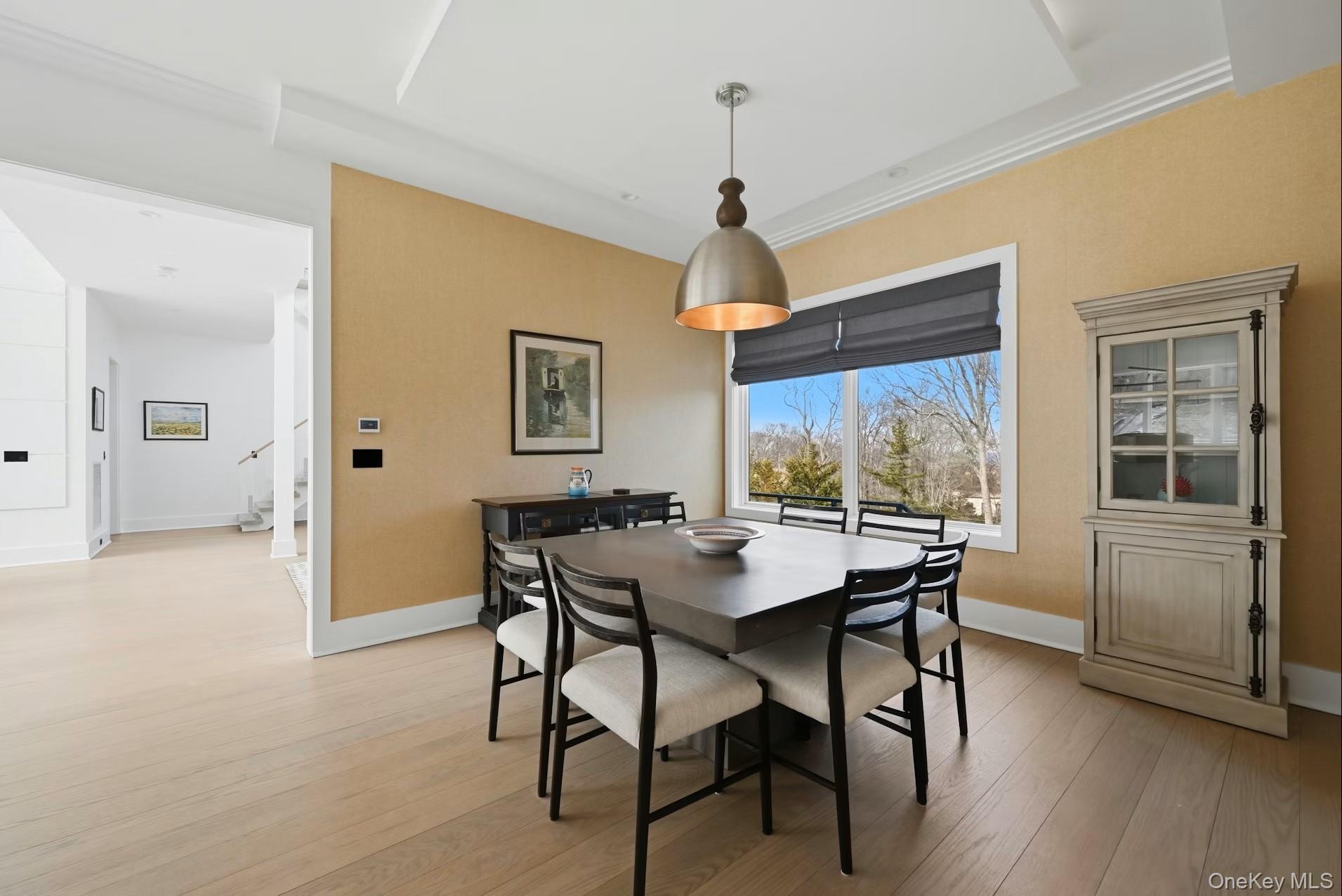 43 Smugglers Path Riverhead, NY 11901 - Photo 8 of 37 a view of a dining room with furniture window and wooden floor
