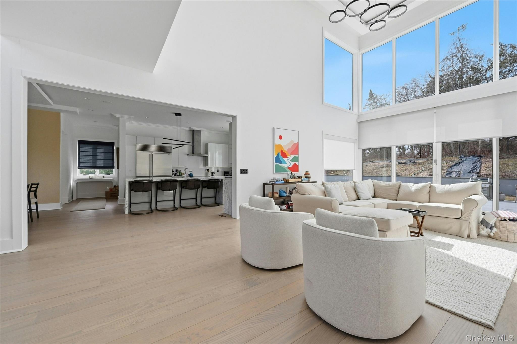 43 Smugglers Path Riverhead, NY 11901 - Photo 9 of 37 a living room with furniture and a table