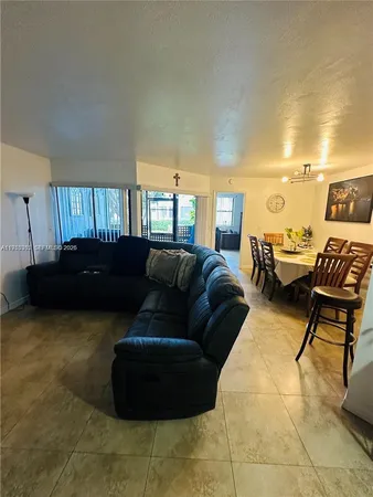 a living room with a couch and a window