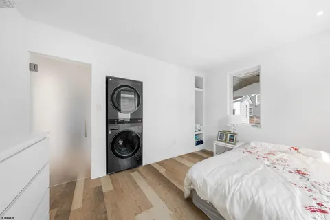 a bedroom with a bed and a view of bedroom