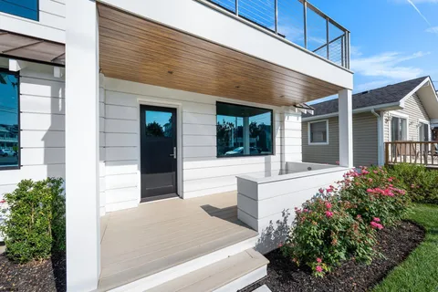 a front view of a house with a porch