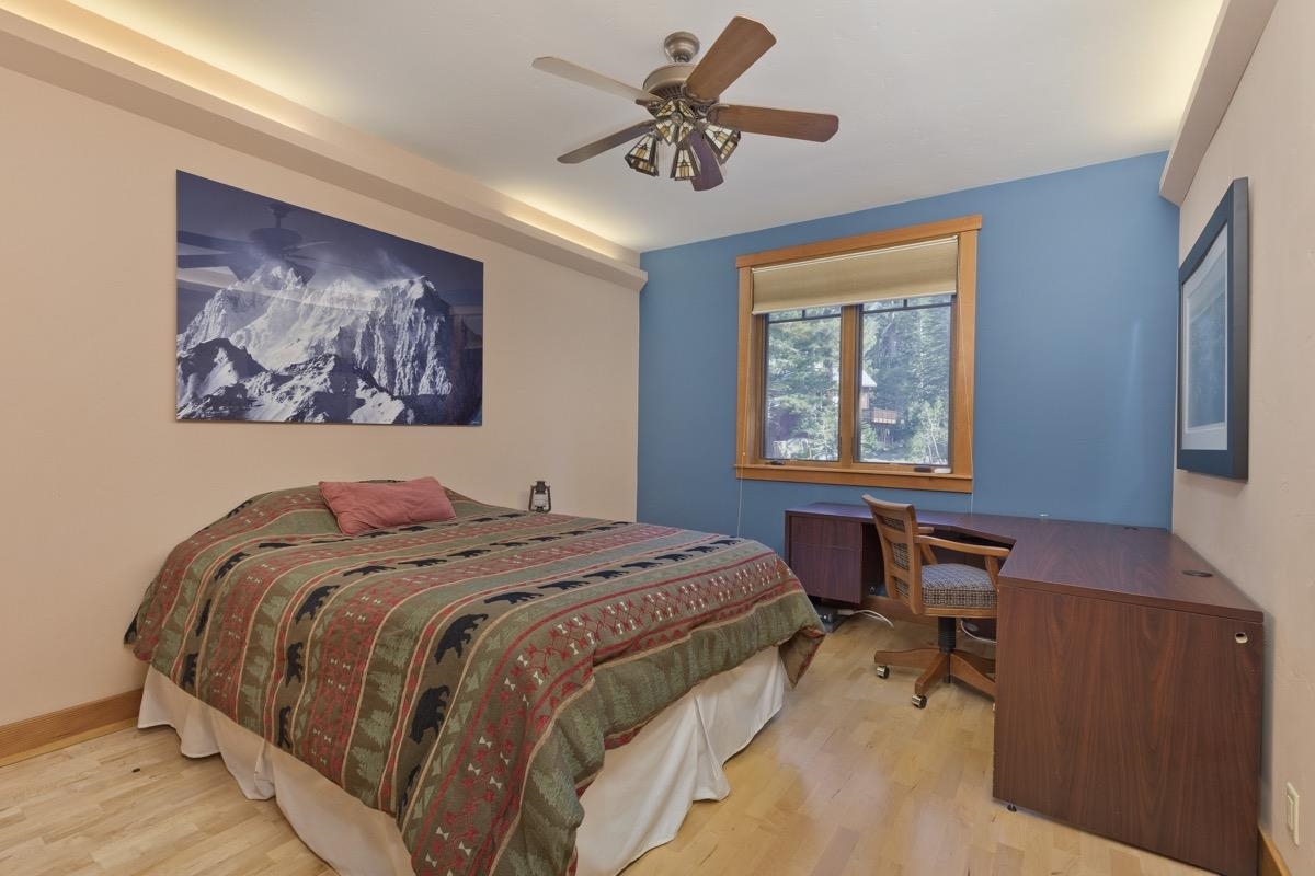 2500 Old Mammoth Road Mammoth Lakes, CA 93546 - Photo 32 of 48 a bed sitting in a bedroom next to a window