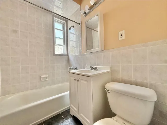a bathroom with a toilet sink and bathtub