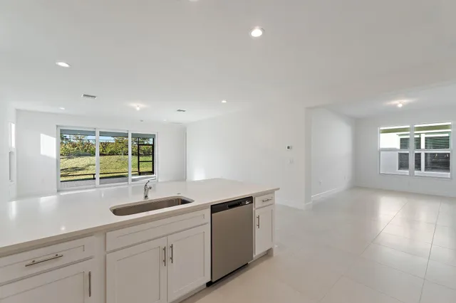 a kitchen with sink and window