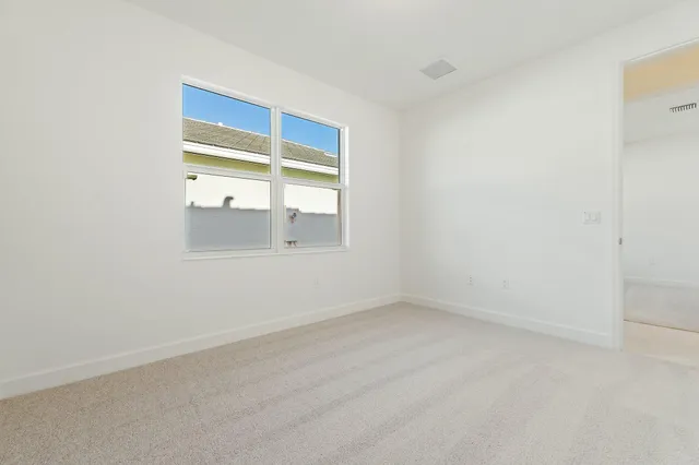 a bathroom with a granite countertop sink a toilet and a mirror