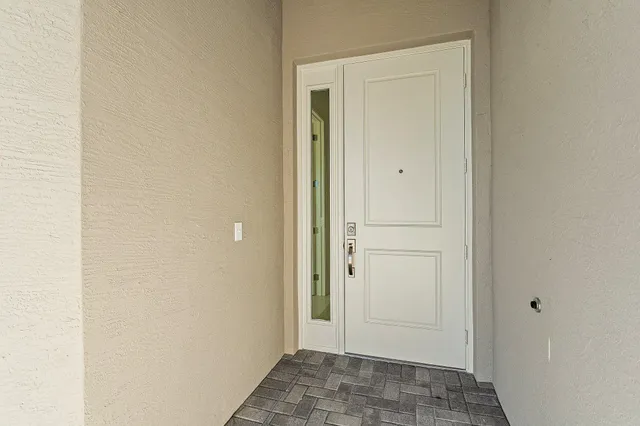 an aerial view of a swimming pool a yard and lake view