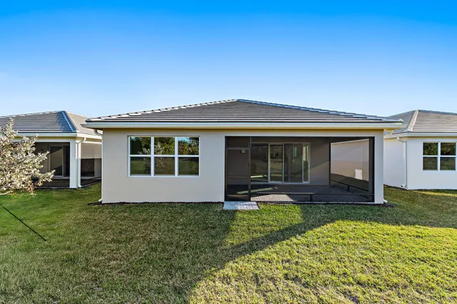 an aerial view of a house with a ocean view