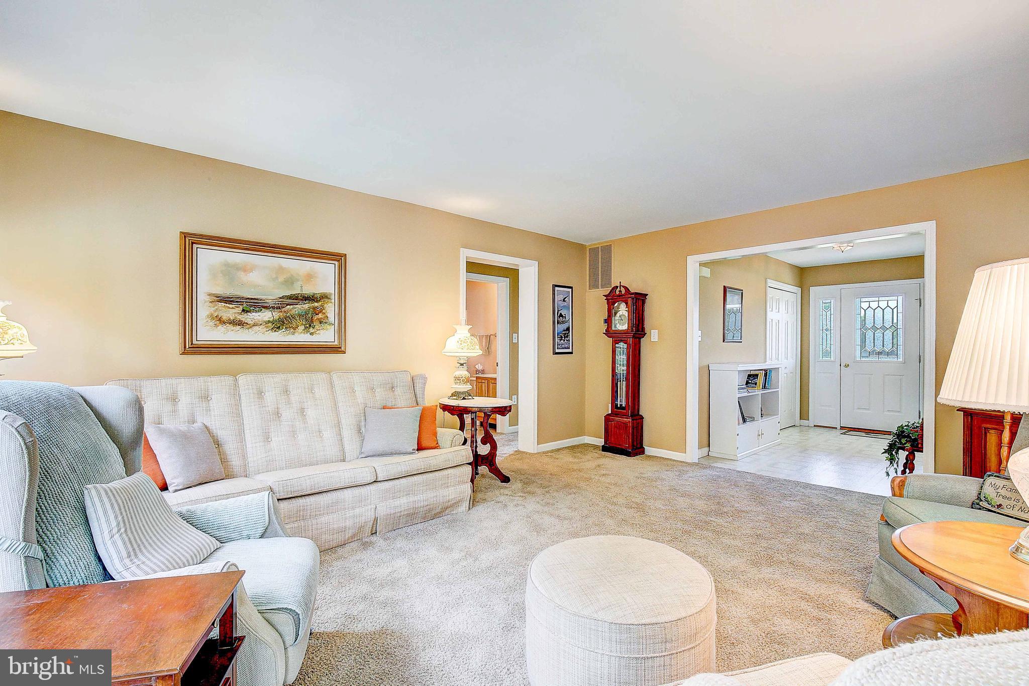 4650 Paul Hance Road Huntingtown, MD 20639 - Photo 25 of 57 a living room with furniture and a large window